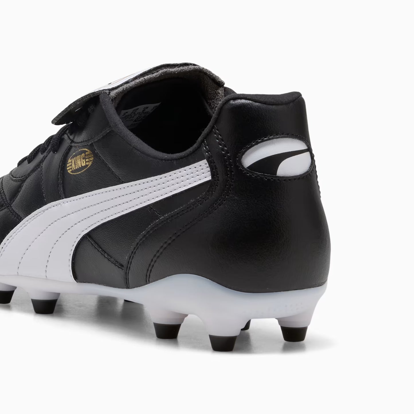 Black and white soccer cleats with a visible brand logo on a white background