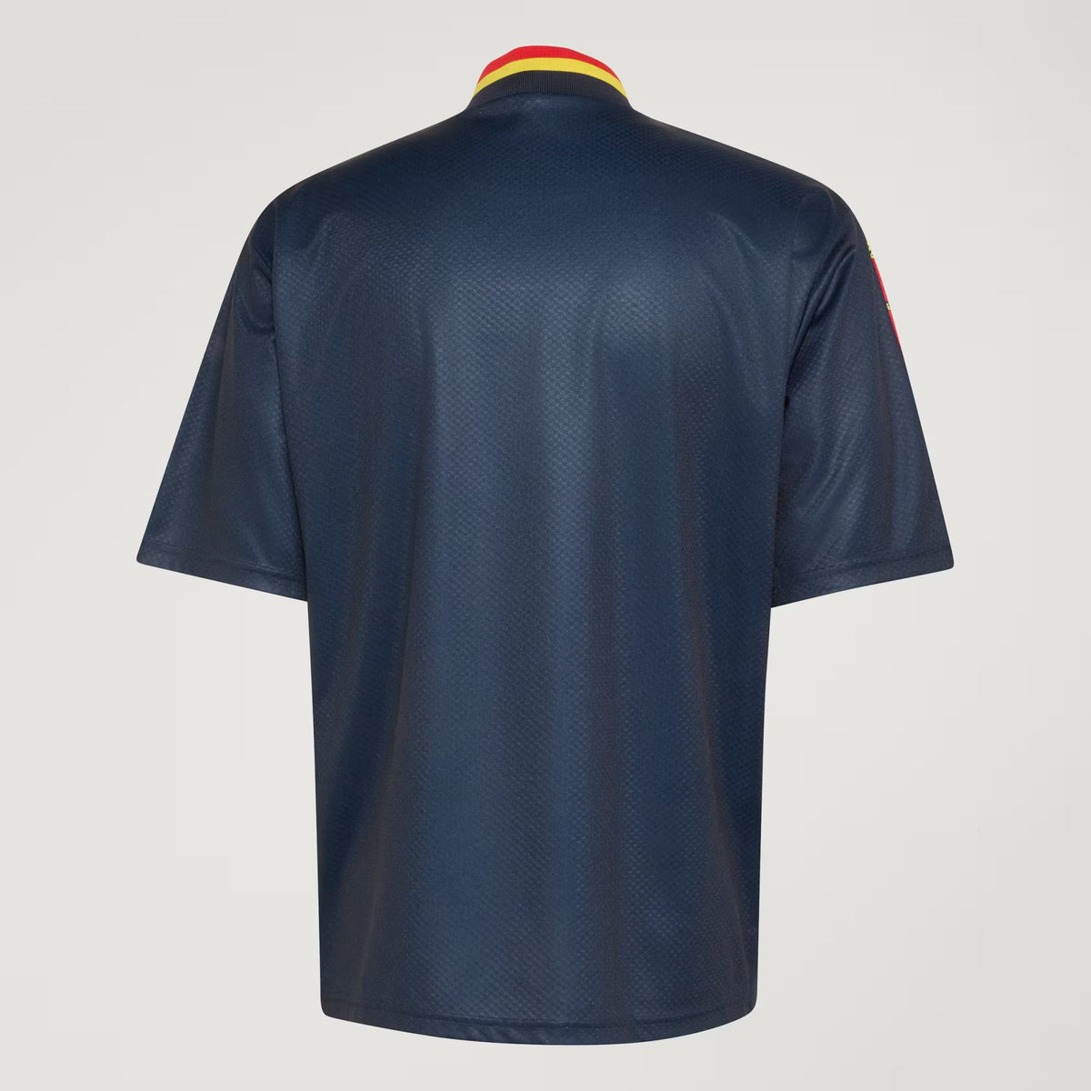 A navy blue short-sleeve athletic jersey shown from the back, featuring a textured mesh fabric and a yellow and red striped collar, set against a light gray background.