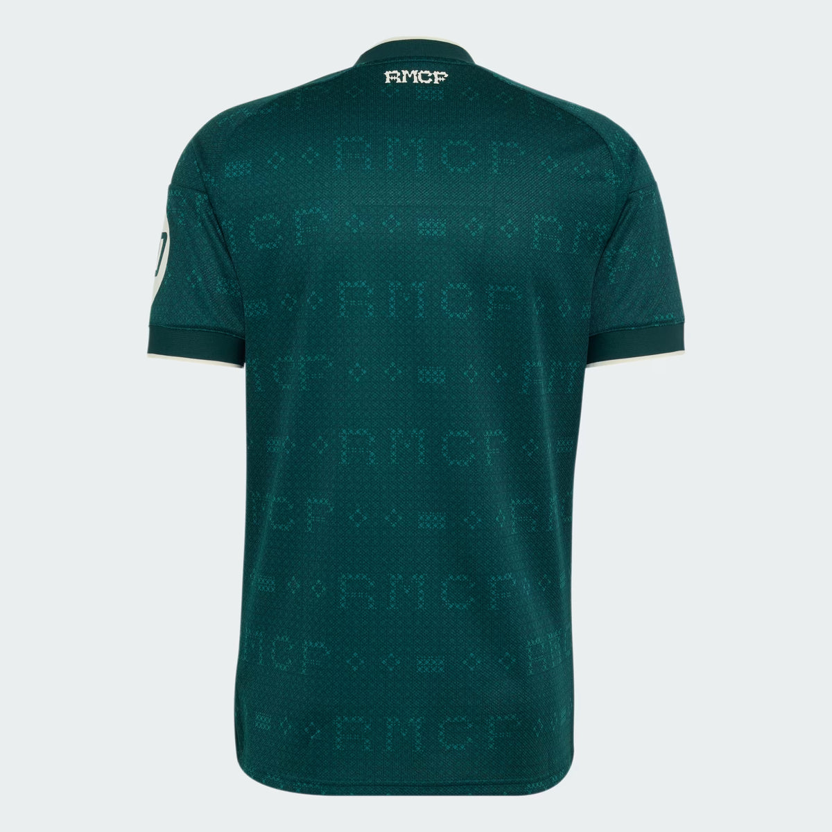 A dark green short-sleeve athletic jersey with a subtle tonal repeating RMCP logo pattern across the back, shown on a light gray background.