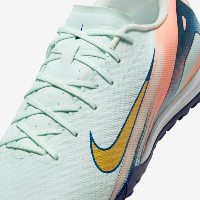 Close-up of Nike Phantom GX 2 Academy FG/MG grip texture and Honeycomb Green finish