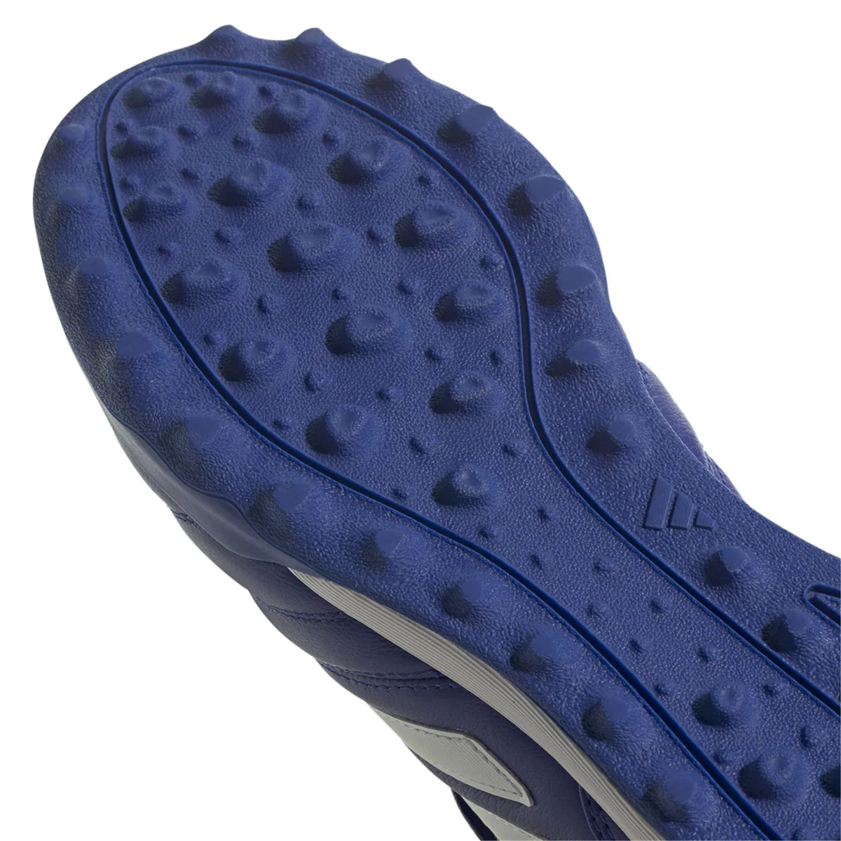 Close-up of a blue shoe sole with textured pattern on a white background