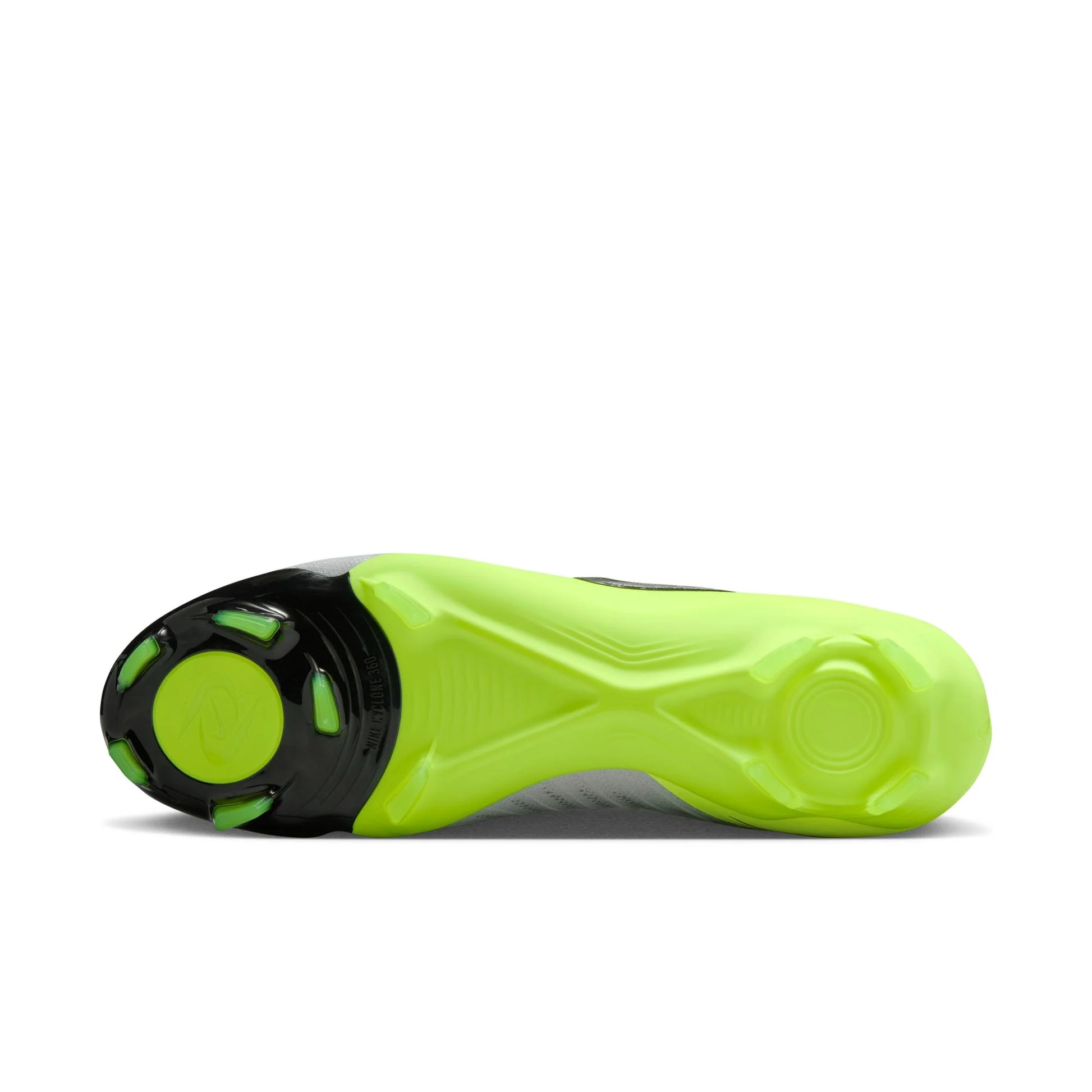 Close-up of a neon green and black shoe sole on a white background