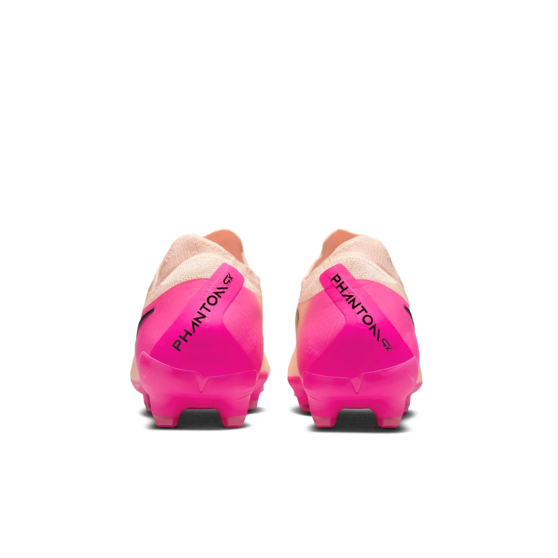 Pink and beige soccer cleats with 'Phantom' branding on a white background