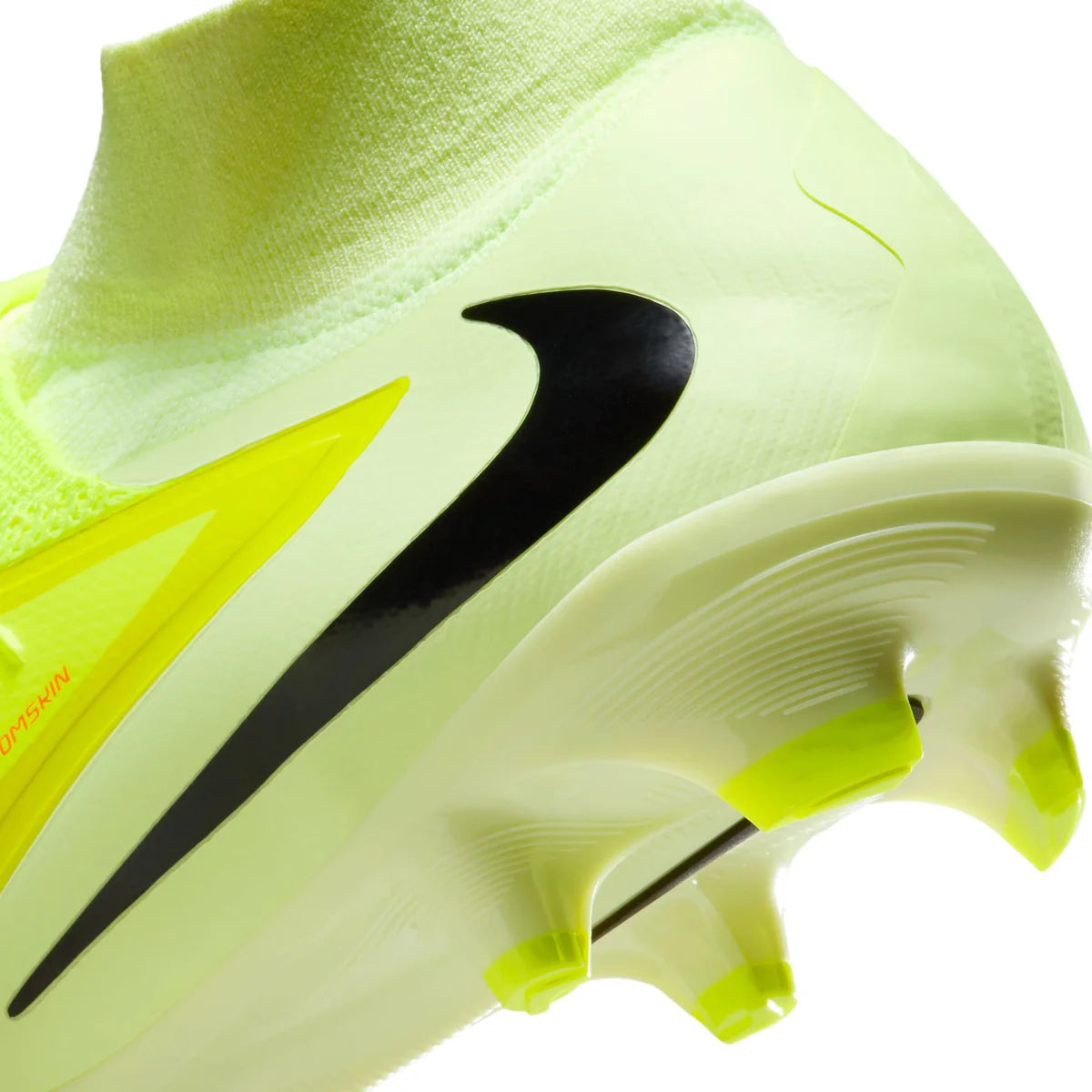 Close-up of a neon green soccer cleat with black swoosh logo on a white background