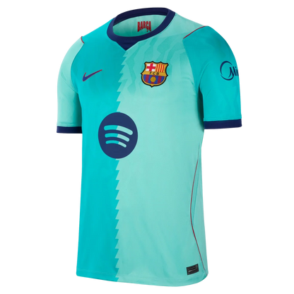 A Nike FC Barcelona home soccer jersey in a light turquoise/aqua colorway, featuring a dark navy blue collar, sleeve cuffs, and logos, including the Spotify sponsor logo on the front.