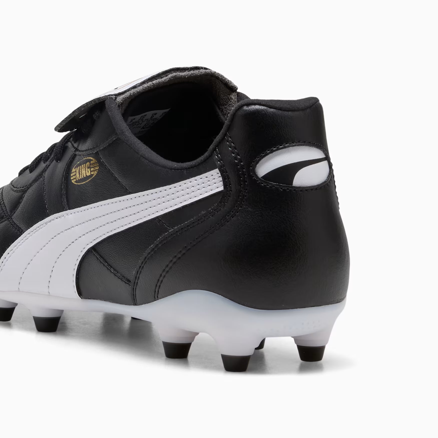 Black and white soccer cleats with a visible brand logo on a white background