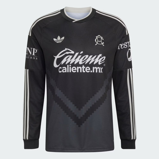 A black long-sleeve soccer jersey with white stripes on the sleeves, featuring the Adidas logo, Caliente.mx sponsor text, and Club America club crest on a light gray background.
