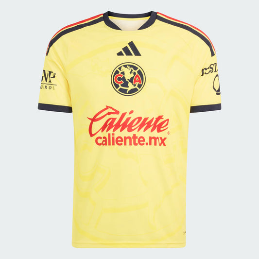 A yellow Club América soccer jersey by Adidas, featuring the club crest, red 'Caliente' sponsor logo, and black and red shoulder stripes, shown on a light gray background.