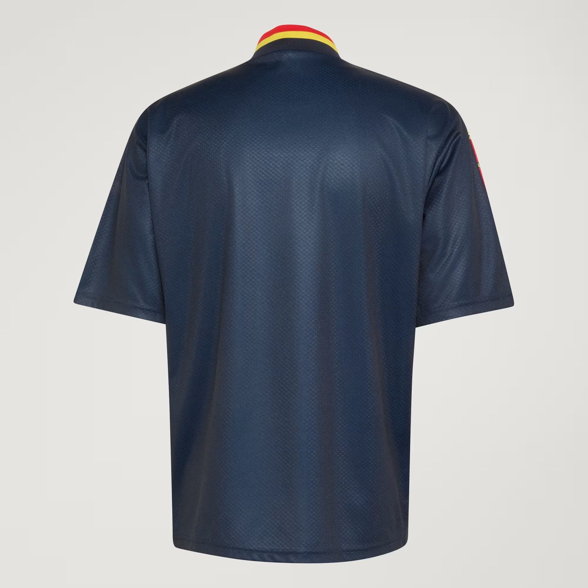 A navy blue short-sleeve athletic jersey shown from the back, featuring a textured mesh fabric and a yellow and red striped collar, set against a light gray background.