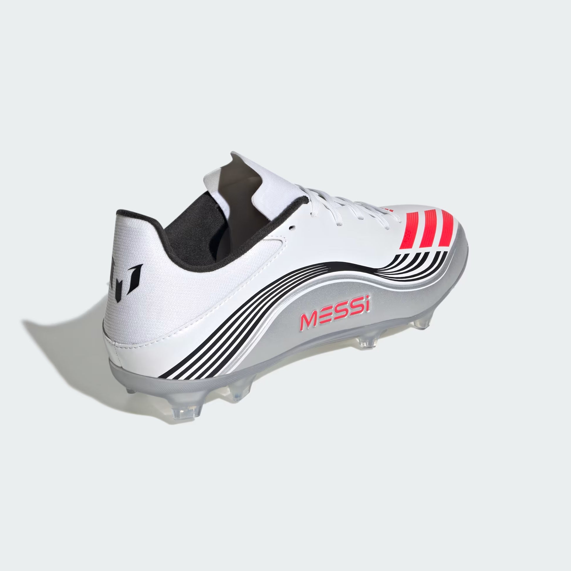White soccer cleat with black and red accents on a light gray background