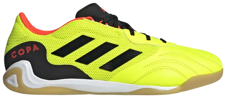 Bright yellow soccer shoe with black stripes and red text on a white background