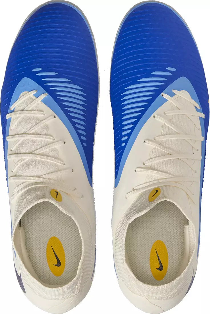 Pair of blue and white sports shoes with Nike logo on a white background