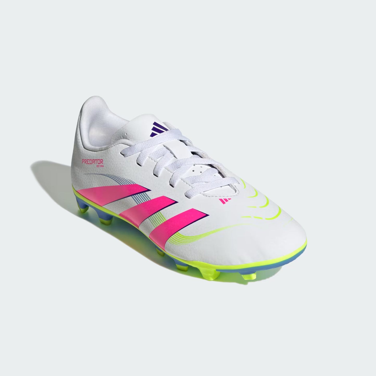 White soccer cleat with pink and yellow accents on a light gray background