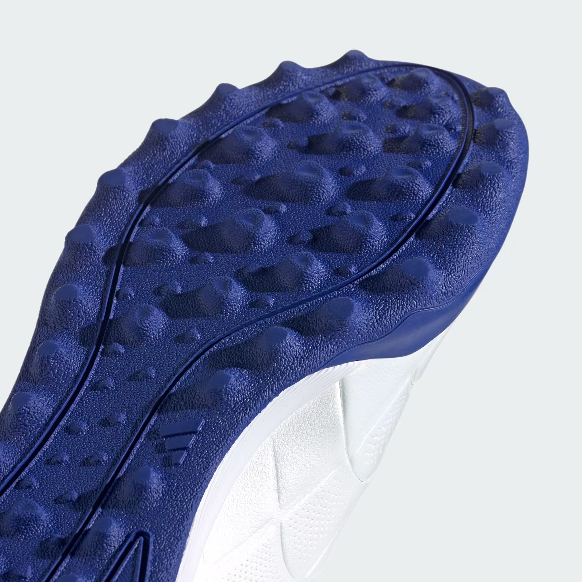 Close-up of a blue textured shoe sole on a white background