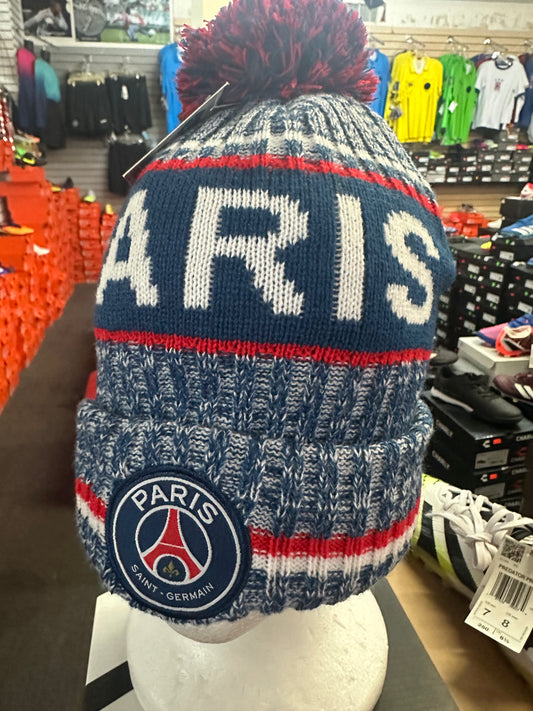 Knitted hat with 'Paris' text and logo in a store setting