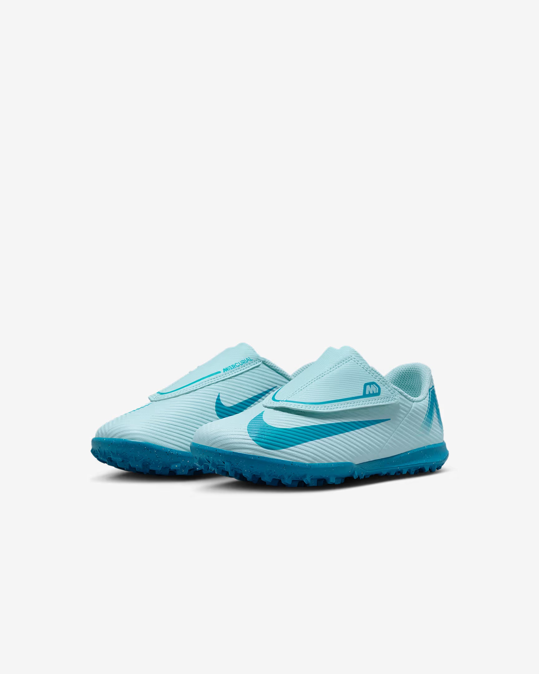 Pair of light blue soccer cleats with a brand logo on a white background