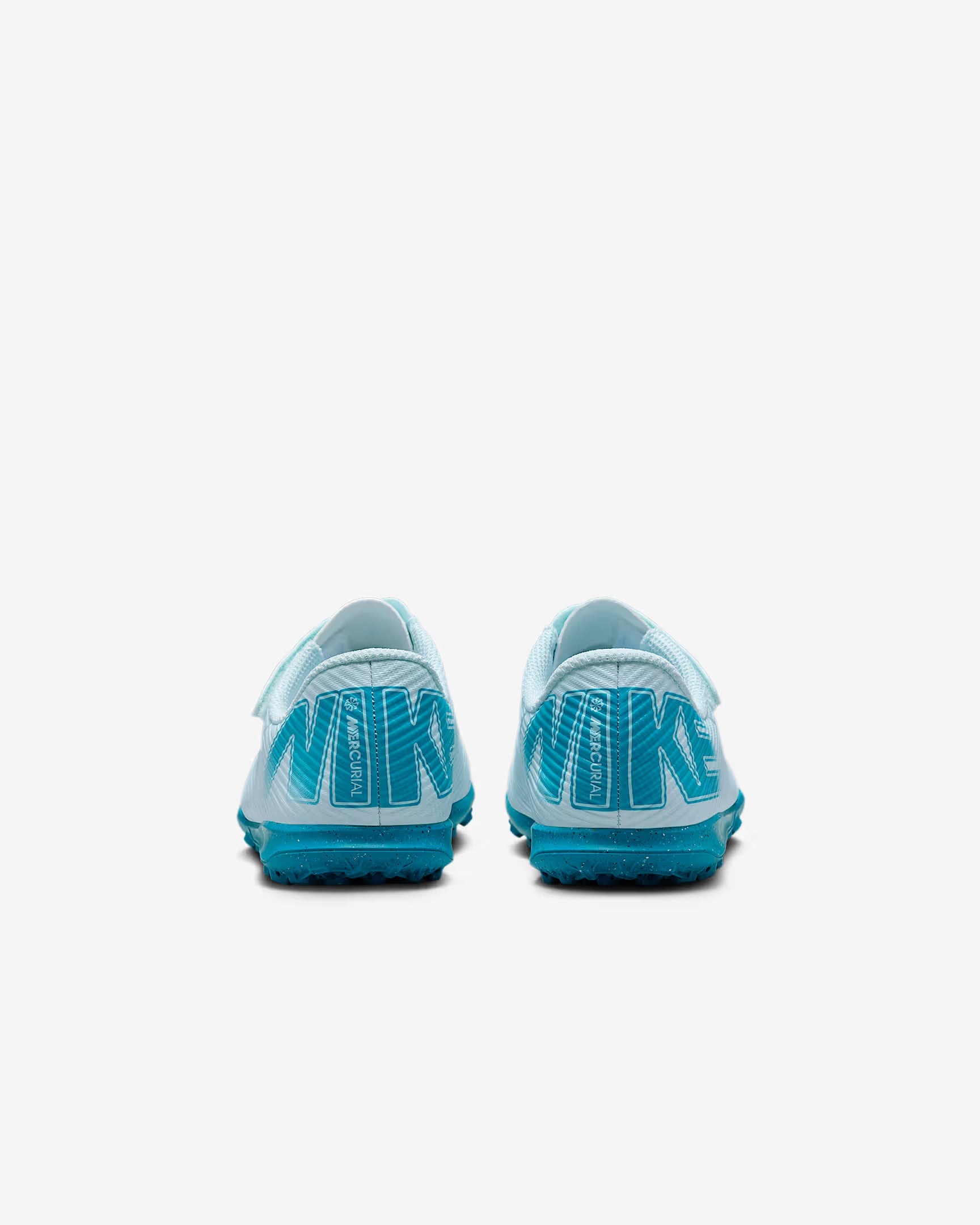 Pair of blue and white Nike soccer cleats on a white background