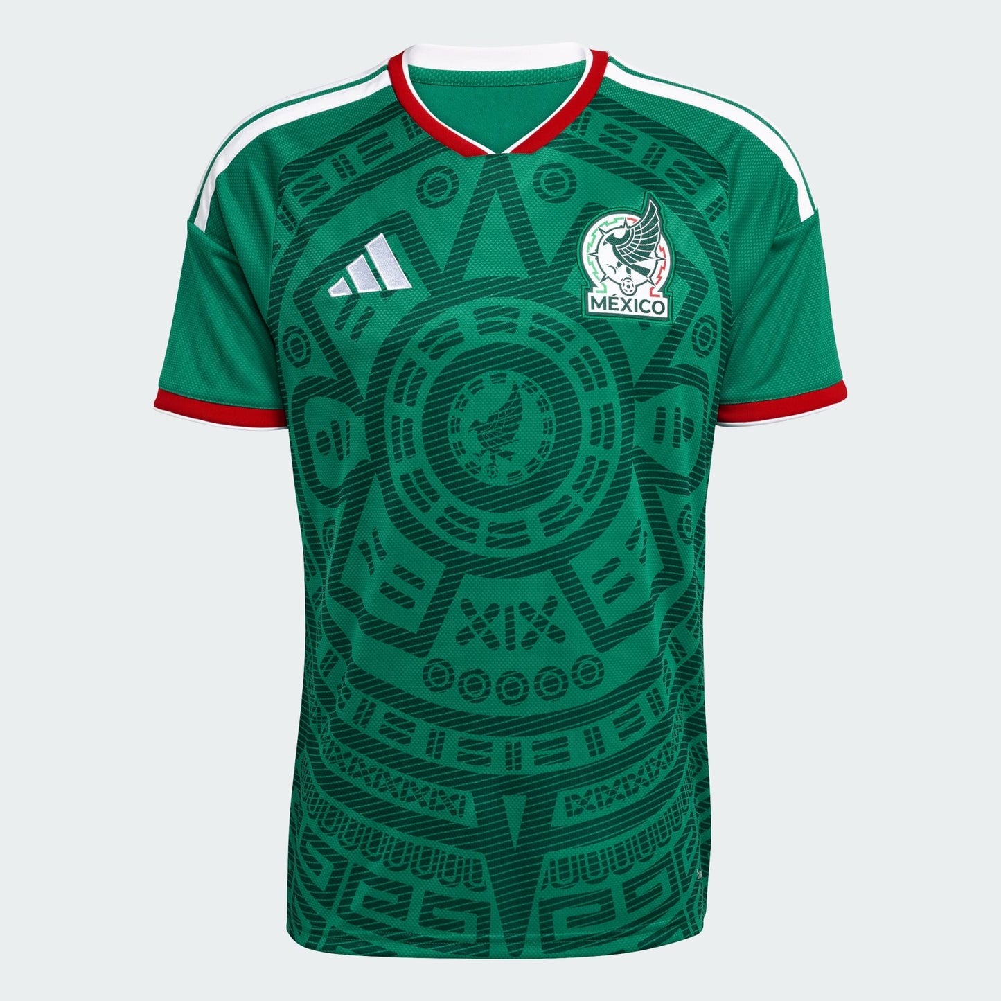 Green soccer jersey with Adidas logo and Mexico emblem on a light gray background