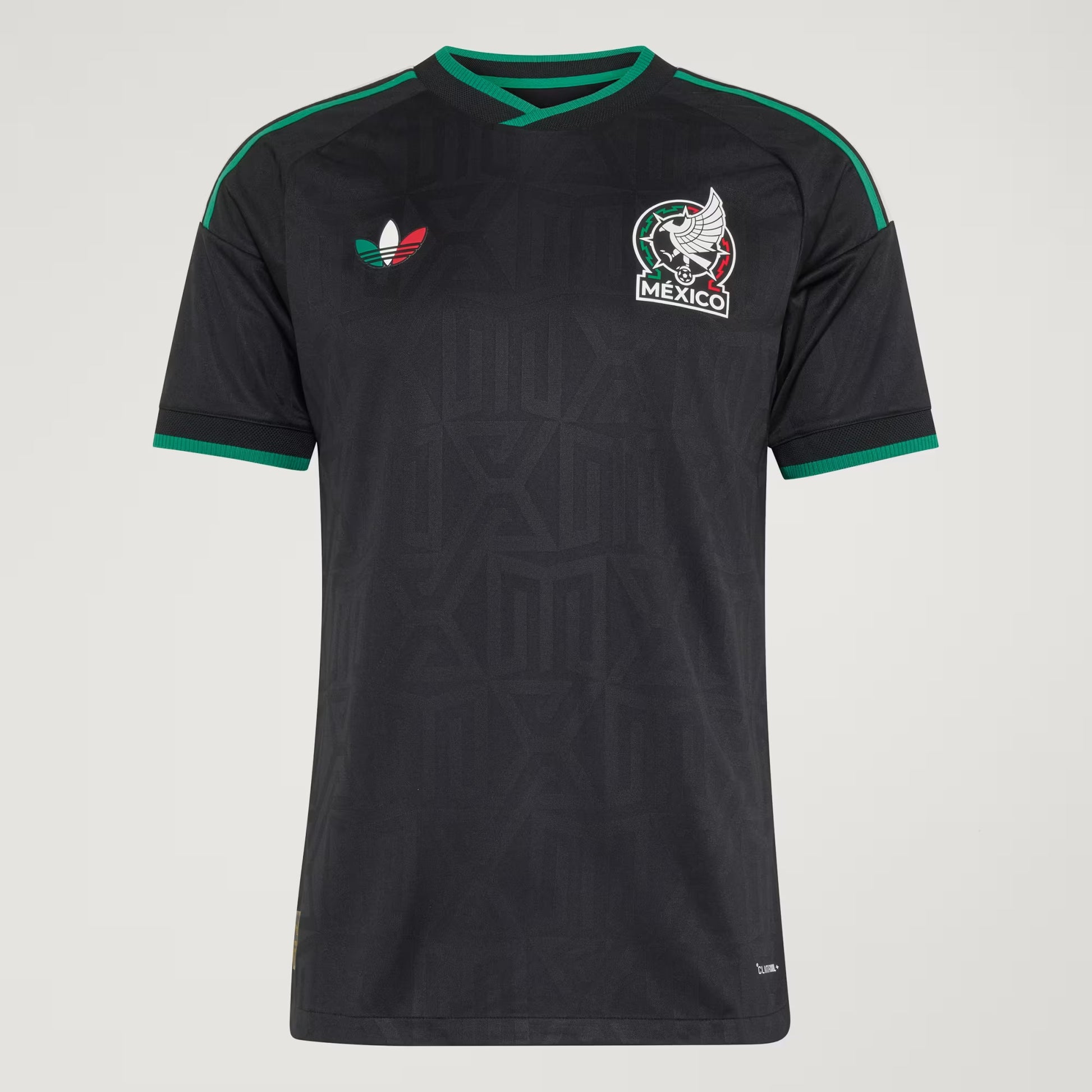 Black soccer jersey with green accents and Mexico national team logo on a gray background
