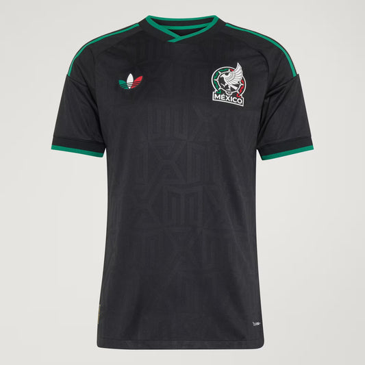 Black soccer jersey with green accents and Mexico national team logo on a gray background