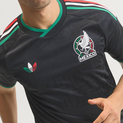 Black sports jersey with Adidas logo and 'Mexico' emblem on a gray background