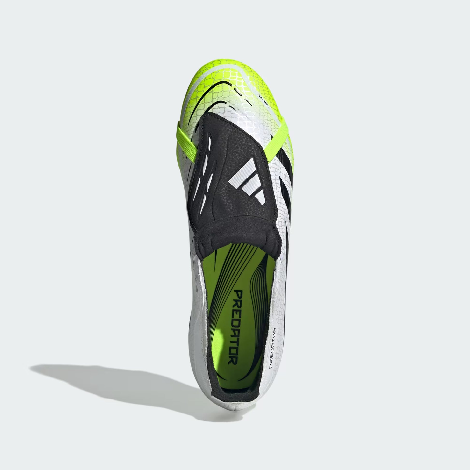 Sole of a sports shoe with 'Predator' branding on a light gray background
