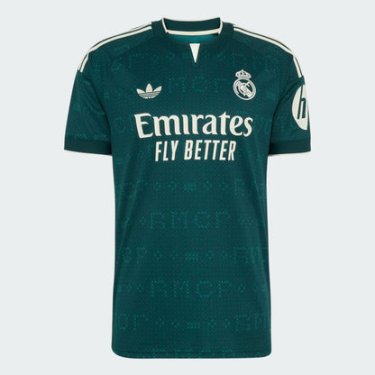 A dark green Real Madrid soccer jersey by Adidas, featuring white branding and sponsor logos, displayed on a light gray background.
