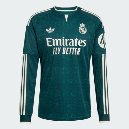 A dark teal Real Madrid long-sleeve soccer jersey with white accents, featuring the Adidas logo, Real Madrid crest, Emirates Fly Better sponsor text, and HP sleeve logo, shown on a light gray background.