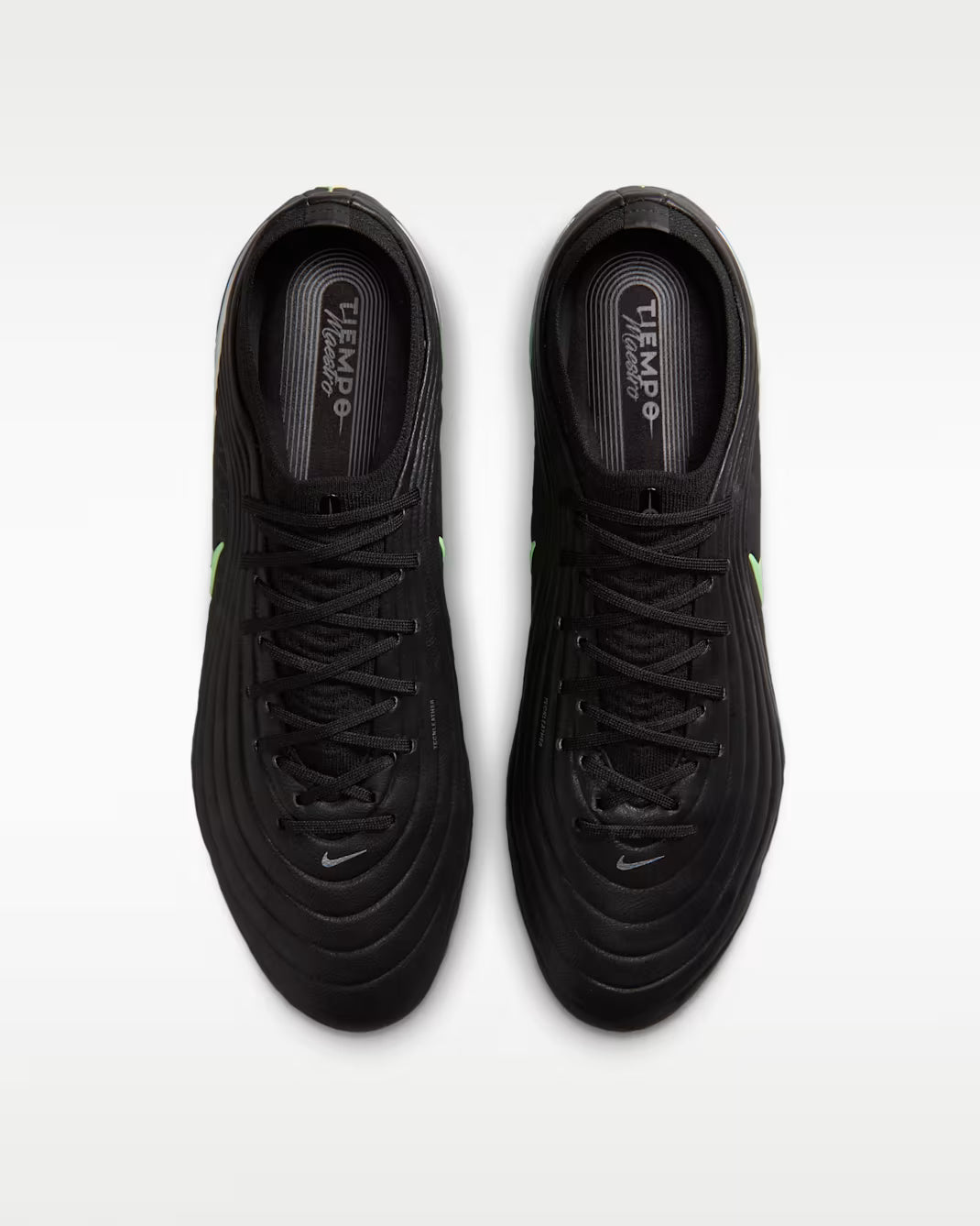 Black soccer cleats with Nike logo on a white background