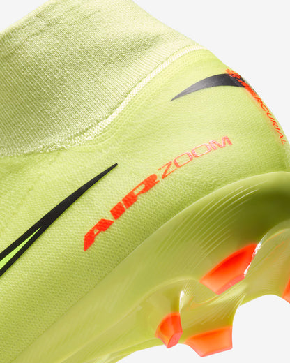 Close-up of a neon green athletic shoe with 'Air Zoom' text on a white background