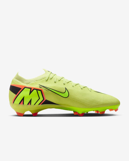 Bright green soccer cleat with black and orange accents on a white background