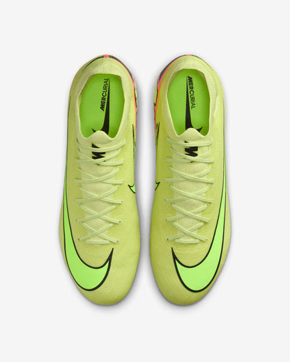 Pair of bright yellow soccer cleats with black swoosh logo on a light gray background