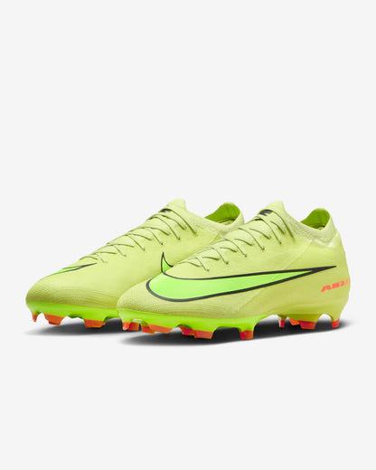 Bright yellow soccer cleats with black swoosh logo on a white background