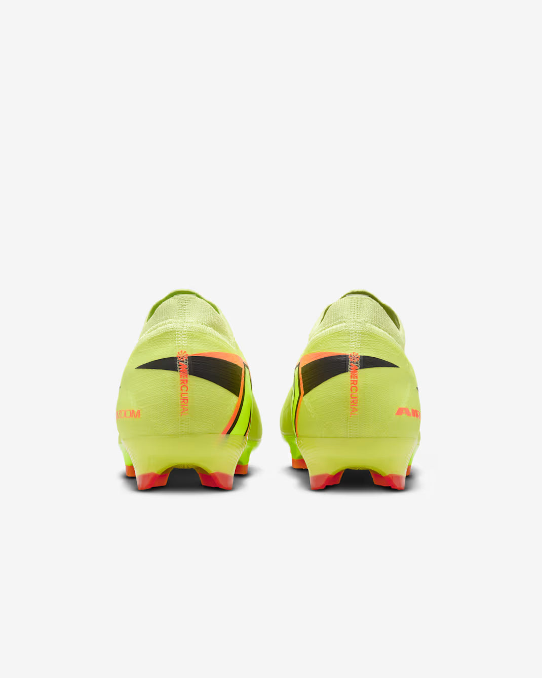 Pair of bright green soccer cleats with black and red accents on a white background