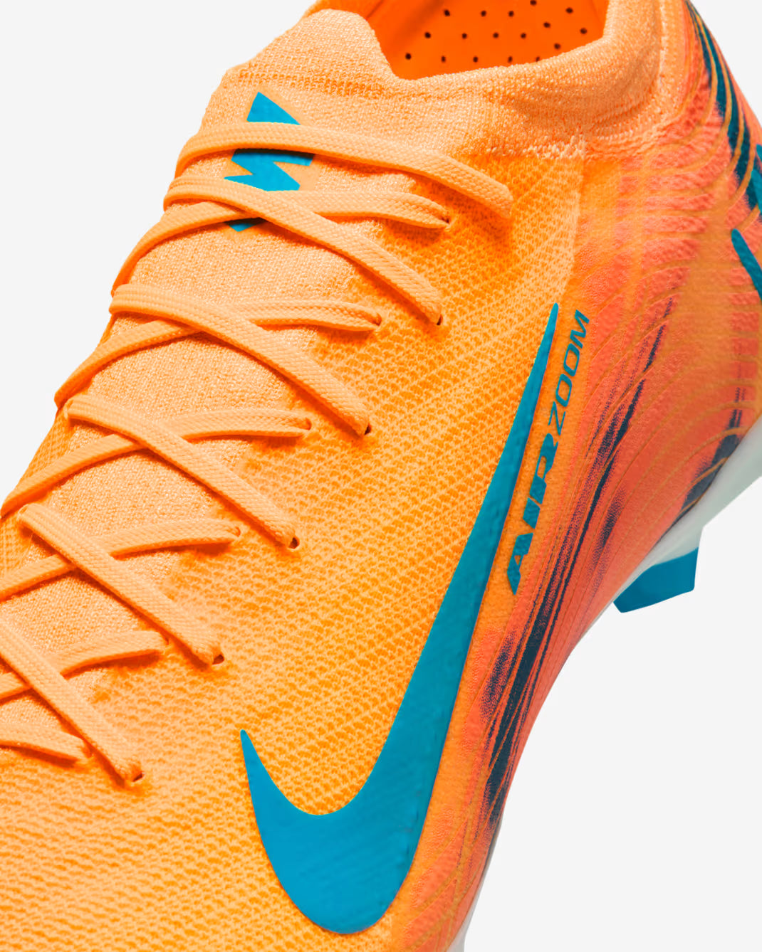 Orange soccer cleat with blue accents on a white background