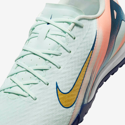 Close-up of Nike Phantom GX 2 Academy FG/MG grip texture and Honeycomb Green finish