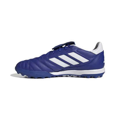 Blue soccer shoe with white stripes on a white background