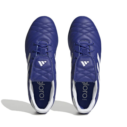 Pair of blue soccer cleats with white soles on a white background